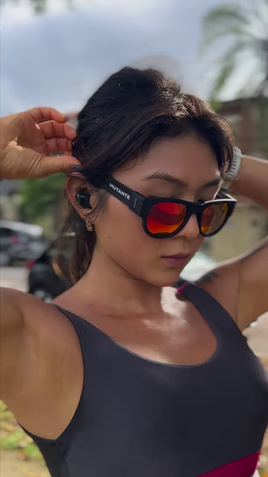 Foldable Sports Sunglasses with Mirrored Red Lenses and Secure Wrist Strap