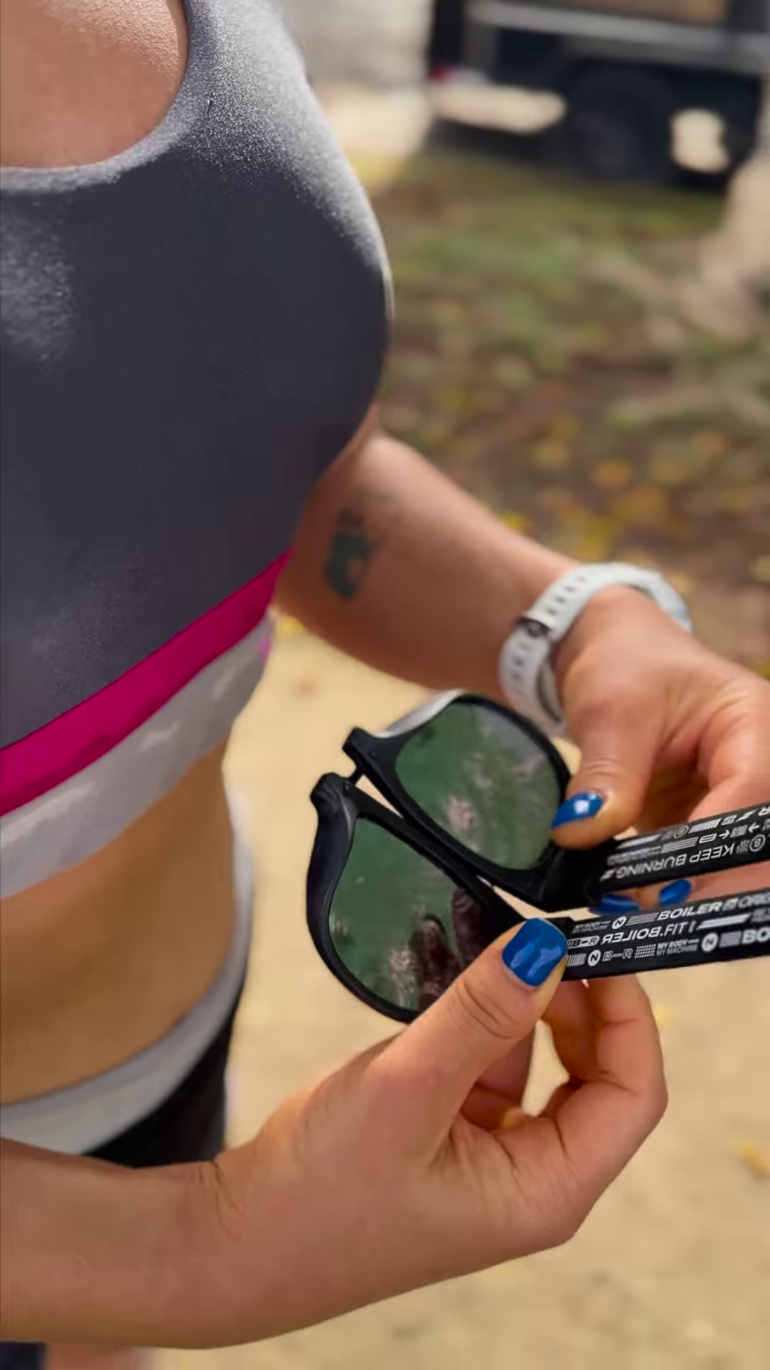 Foldable Sports Sunglasses with Mirrored Red Lenses and Secure Wrist Strap