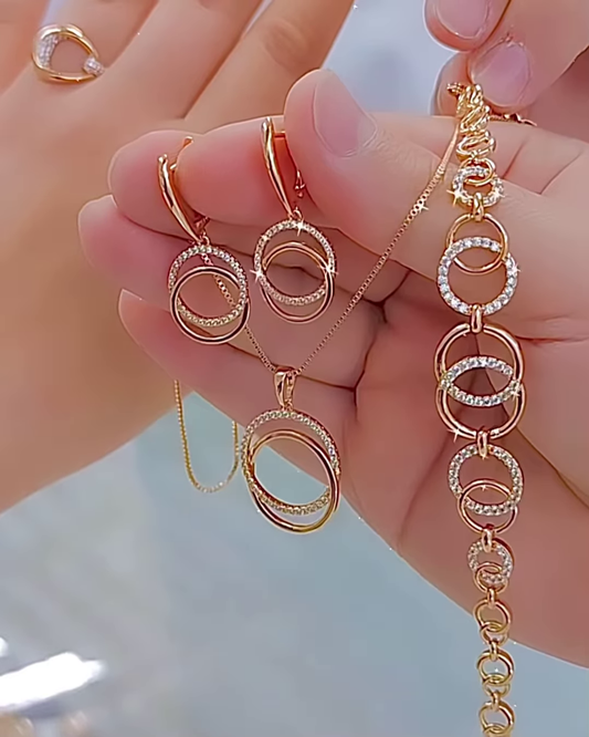 Elegant Rose Gold Tone Jewelry Set with Interlocking Circle Design and Sparkling Accents