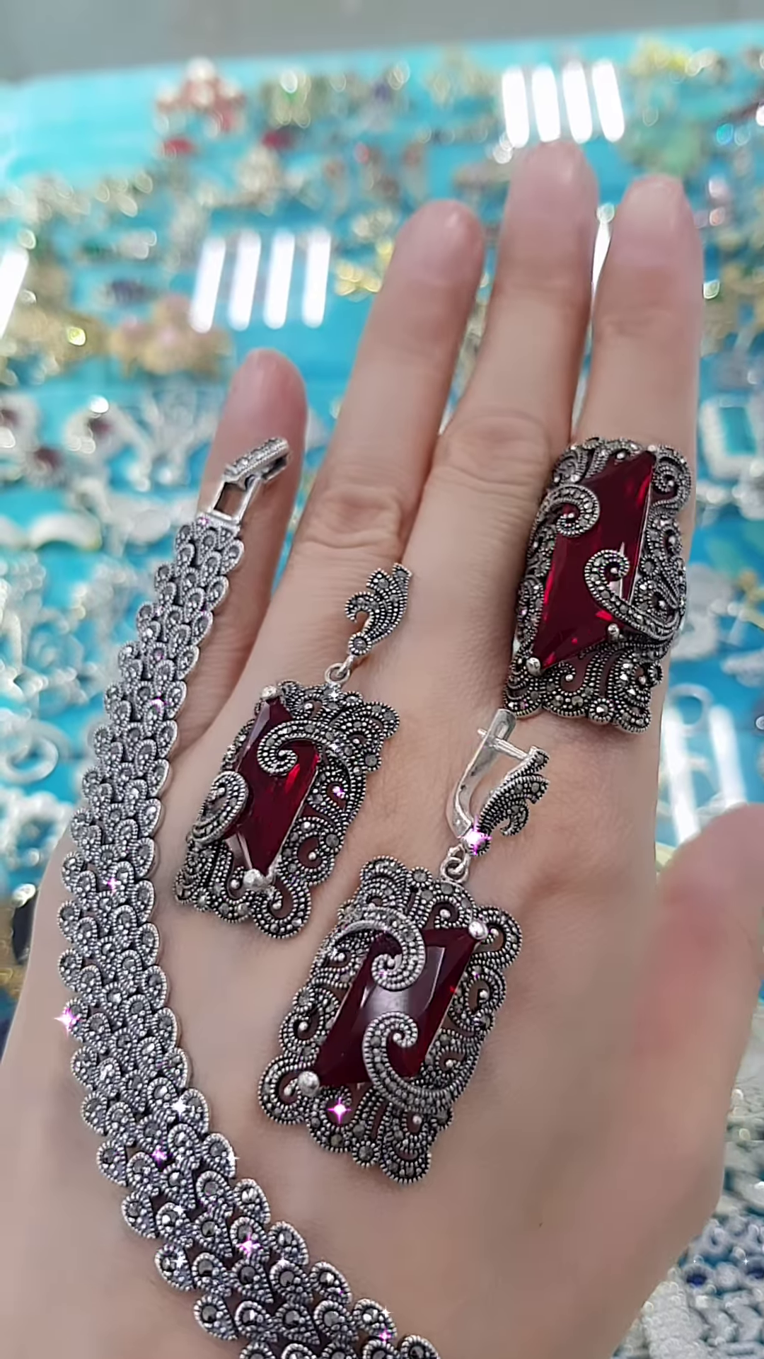 Ornate Oxidized Silver-Toned Jewelry Set with Bold Red Gemstones and Intricate Detailing