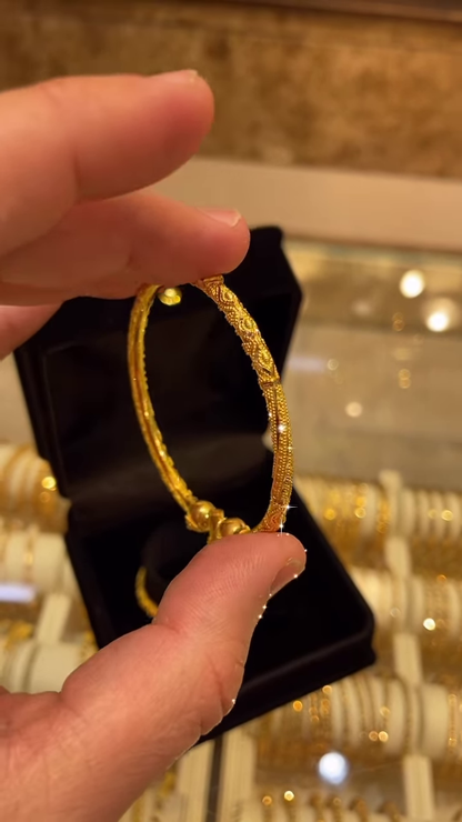 Exquisite Gold-Toned Bangle with Intricate Traditional Filigree and Textured Detailing