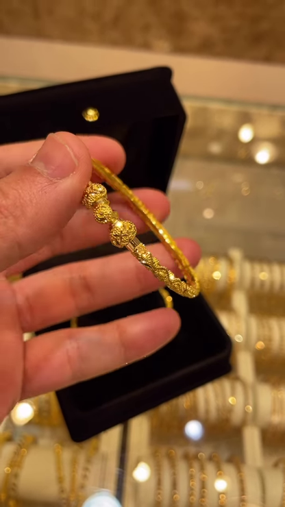 Exquisite Gold-Toned Bangle with Intricate Traditional Filigree and Textured Detailing