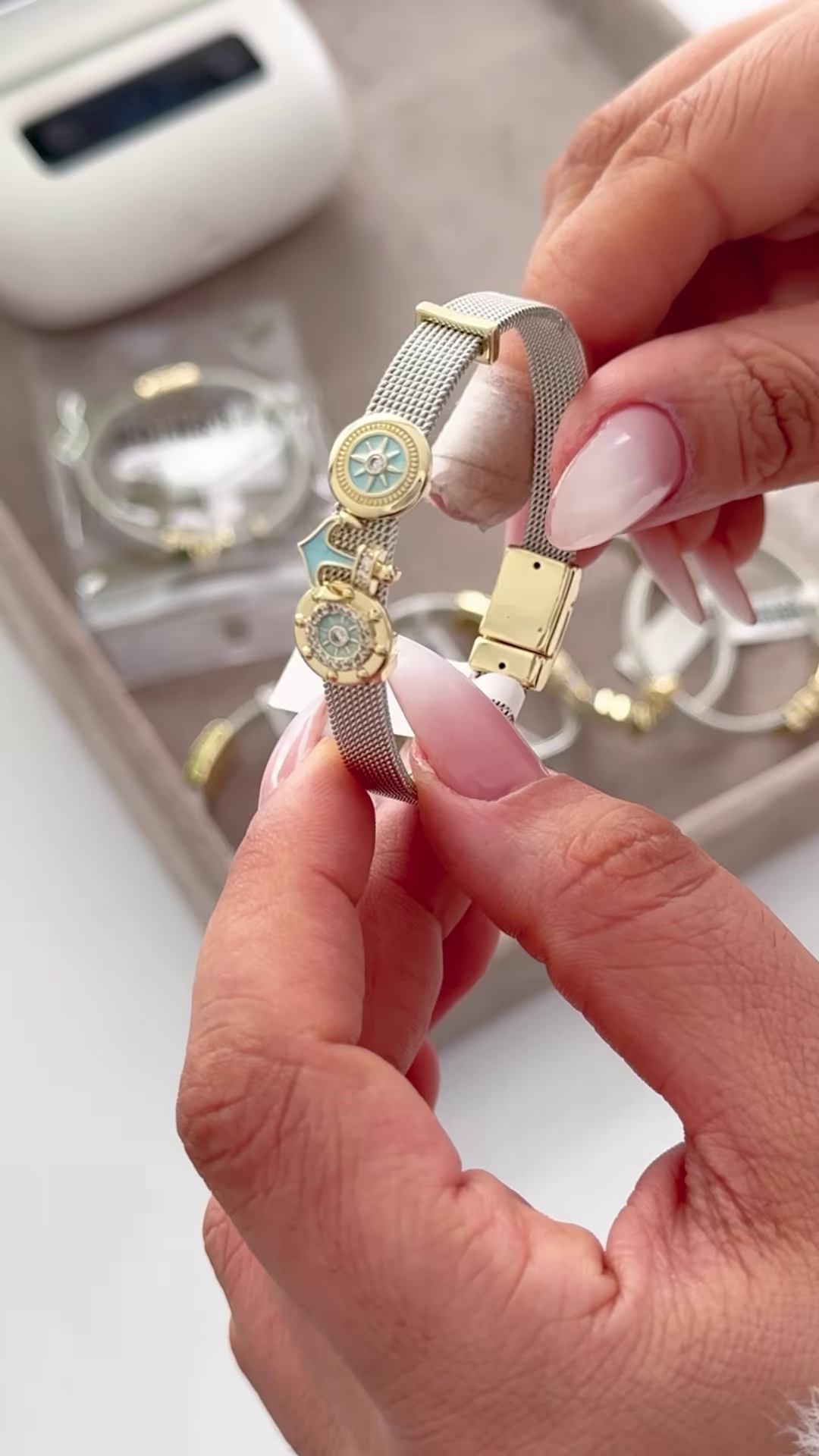 Elegant Silver-Toned Mesh Bracelet with Gold Accents and Crown Charm