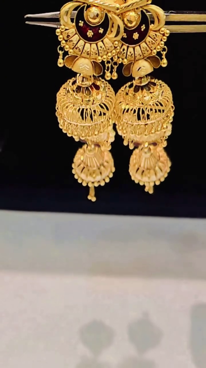 Ornate Gold-Toned Jhumka Earrings with Traditional Filigree and Red Accents