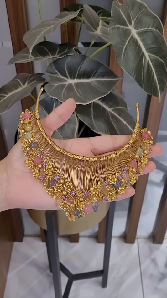 Ornate Gold-Toned Statement Necklace with Multi-Colored Gemstones and Floral Accents