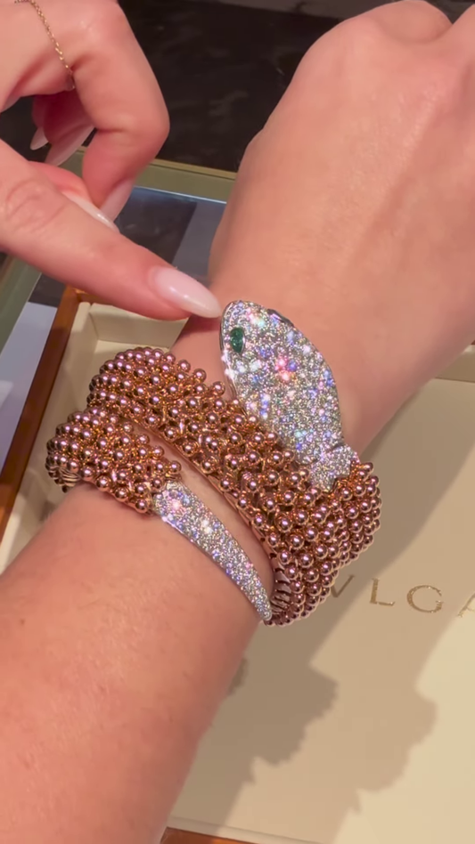 Exotic Rose Gold-Toned Coiled Snake Bracelet with Dazzling Clear Gemstones and Emerald-Inspired Eyes